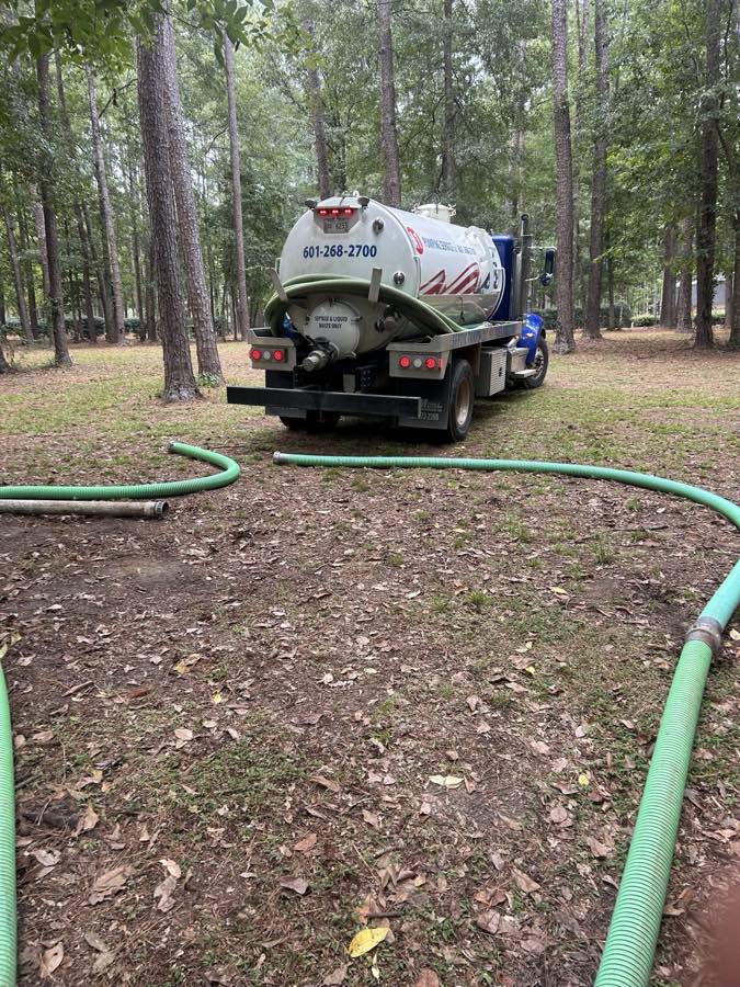 A1 Pumping Service LLC septic pump truck on a job